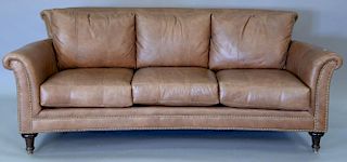 Brown leather upholstered sofa marked Ferguson Copeland Ltd. wd. 88in.