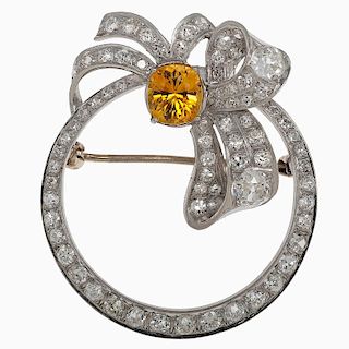 Circle and Bow Pin with Diamonds and Yellow Sapphire