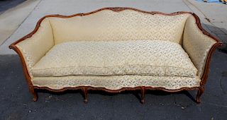 Louis XV style carved walnut upholstered sofa.