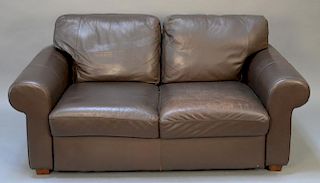 Brown leather loveseat.