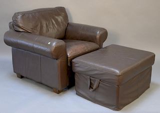 Large brown leather chair and ottoman.