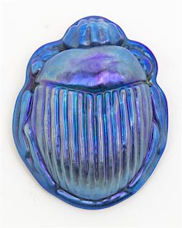 An Iridescent Glass Scarab, Length 4 1/2 inches.