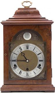 * A Walnut Bracket Clock, Elliott of London, Height of first 15 inches.