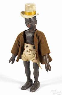 Schoenhut painted wood African chief with a two-part head, wearing the original outfit, 8 3/4'' h.