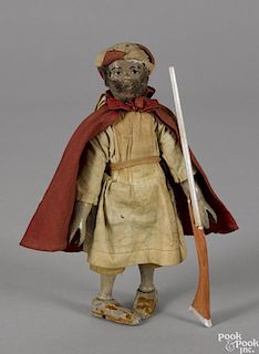 Rare Schoenhut painted wood Arab chief with a cape, a turban, and an associated rifle, 7 1/2'' h.