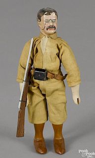 Schoenhut painted wood Teddy Roosevelt with a rifle, 8'' h.