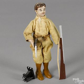 Schoenhut painted wood Kermit with an associated rifle, pistol, and a camera, 8'' h.