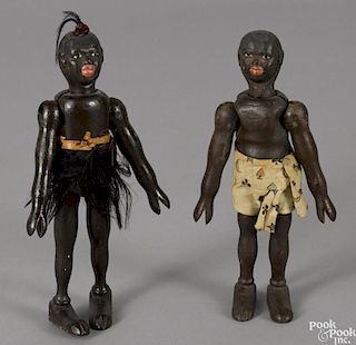 Two Schoenhut painted wood African natives, each with a two-part head, 8'' h.
