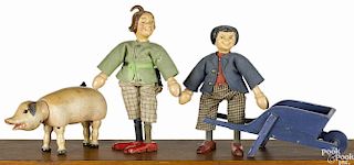 Schoenhut Max and Moritz figures, each with a two-part head, 8'' h., together with a pig