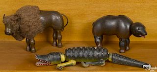 Three Schoenhut painted wood animals with glass eyes, to include a bear, 8'' l., a buffalo, 8'' l.