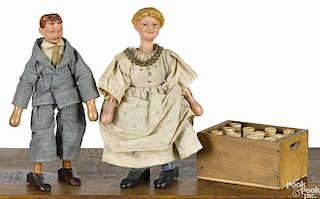 Two Schoenhut painted wood figures, 7 1/2'' h., together with a milk crate.