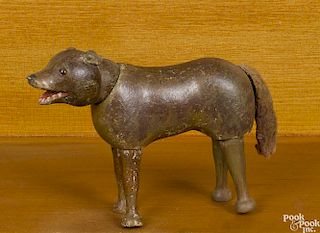 Schoenhut painted wood wolf with a two-part head, glass eyes, and a fuzzy cloth tail, 6 1/2'' l.