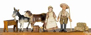 Schoenhut painted wood farmer group, to include a farmer, a milk maid with a two-part head