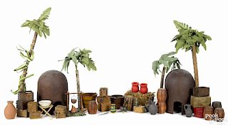 Schoenhut safari accessories, to include original crates and contemporary huts and trees.
