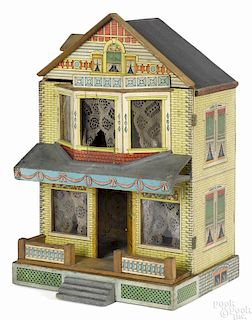 Attributed to Bliss, paper lithograph over wood doll house with a dormer and a front porch, 19'' h.