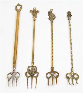 * A Set of English Brass Toast Forks, Length of longest 26 inches.