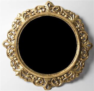 A Continental Giltwood Mirror, Diameter 28 inches.