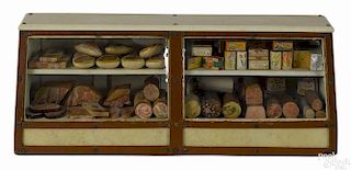 Toy butcher shop deli counter with a faux leather and vinyl covered case with a plexi glass front