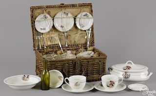 Child's nine-piece porcelain picnic set with the original woven basket, a wine bottle, napkins
