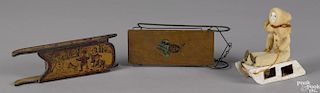 Three miniature wooden sleds, one with a decal of a Native American Indian, 7 3/4'' l.