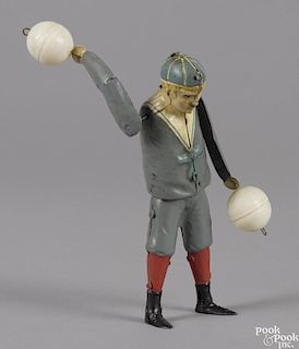Gunthermann hand painted tin clockwork ball twirling boy, 7 1/4'' h.