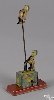 George Kellerman tin lithograph wind-up Oriental acrobat toy, 7 1/2'' h.