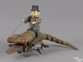 Unusual German composition and wood man riding an alligator clockwork toy