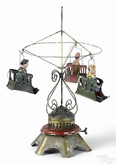 Painted tin clockwork musical carousel roundabout, stamped V & R, 13 1/4'' h.