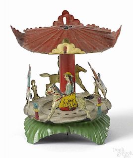 Meier tin lithograph carousel penny toy with children riding horses, 2 1/2'' h.