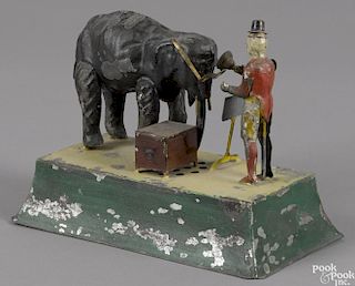 Gunthermann hand painted tin clockwork clown and elephant playing a hand grinder, with a music box