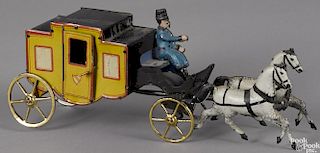 Tin lithograph horse drawn coach floor toy with opening doors, 12'' l.