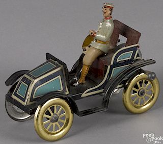 German tin lithograph roadster with an interior flywheel and a nicely detailed driver, 5 1/2'' l.