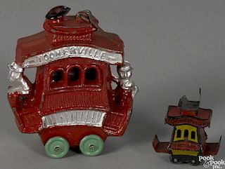 Two Toonerville Trolleys, to include a penny toy, 1 3/4'' h., and a slush metal, 3 1/2'' h.