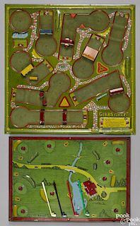 Gibbs tin lithograph golf game with a mahogany framed stand, four golf clubs, and balls