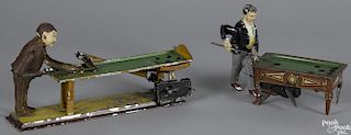 Two Gunthermann tin clockwork pool players, to include one with a black coat, 6'' h., 8'' w.