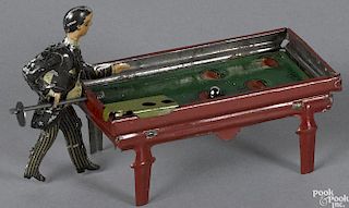 German tin lithograph pool player penny toy, 4'' w.