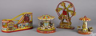 Four Chein amusement park rides, to include a lithographed tin Ferris wheel with a box