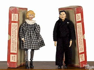Two Swiss Bucherer metal ball jointed woman and gentleman Saba figures, in their original box