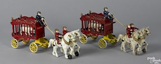 Two Kenton cast iron Overland Circus horse drawn cage wagons, each with two riders, a driver