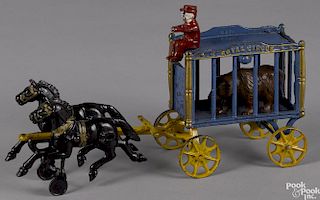 Hubley cast iron horse drawn Royal Circus cage wagon with a bear and a driver, 15 3/4'' l.