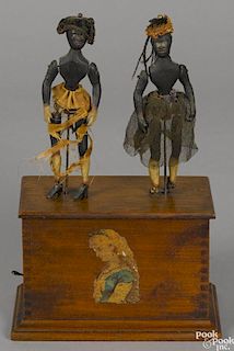 Clockwork dancing black Americana figures on an oak finger jointed box with a decal