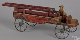 Painted wood Hook and Ladder Fire Dept. ladder truck, with tin wheels and a driver, 16 1/2'' l.