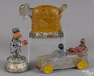 Three painted glass candy containers, to include Barney Google, Spark Plug, and an Amos 'N' Andy