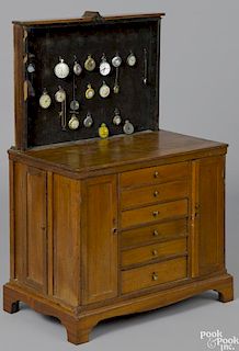 Unusual child size walnut watch maker's chest with a sliding display board