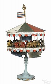 Unique Philadelphia painted tin and wood carousel wind driven toy with painted wood animal figures