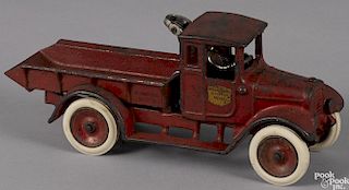 Arcade cast iron International Harvester dump truck with a nickel-plated driver, a winch