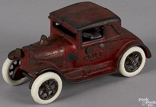 Arcade cast iron Fire Chief coupe car with a nickel-plated driver and rubber wheels, 6 3/4'' l.