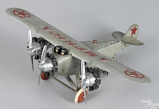 Hubley cast iron America tri-motor airplane with a pilot, a co-pilot, rubber wheels