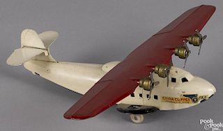 Wyandotte pressed steel Panama Clipper airplane with four spinning propellers, wingspan - 13''.