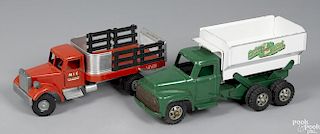 Two pressed steel delivery trucks, to include a Smith Miller MIC of California stake truck